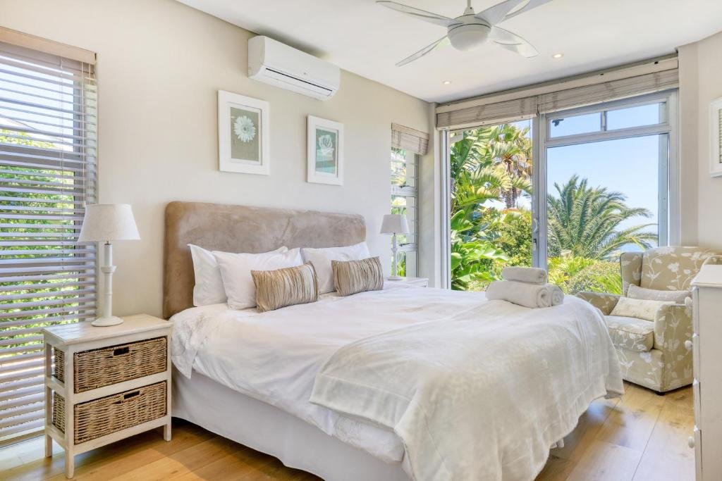 Bright bedroom with garden views and air conditioning