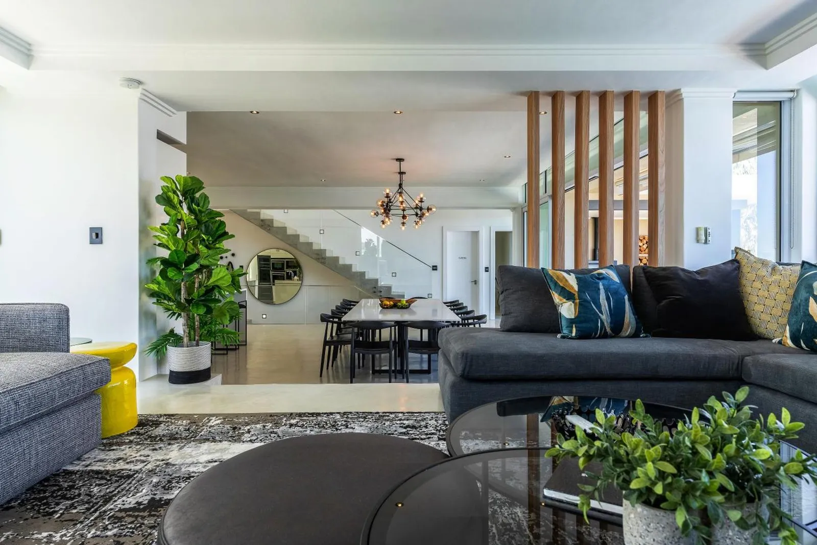 Open-plan living and dining beside the staircase
