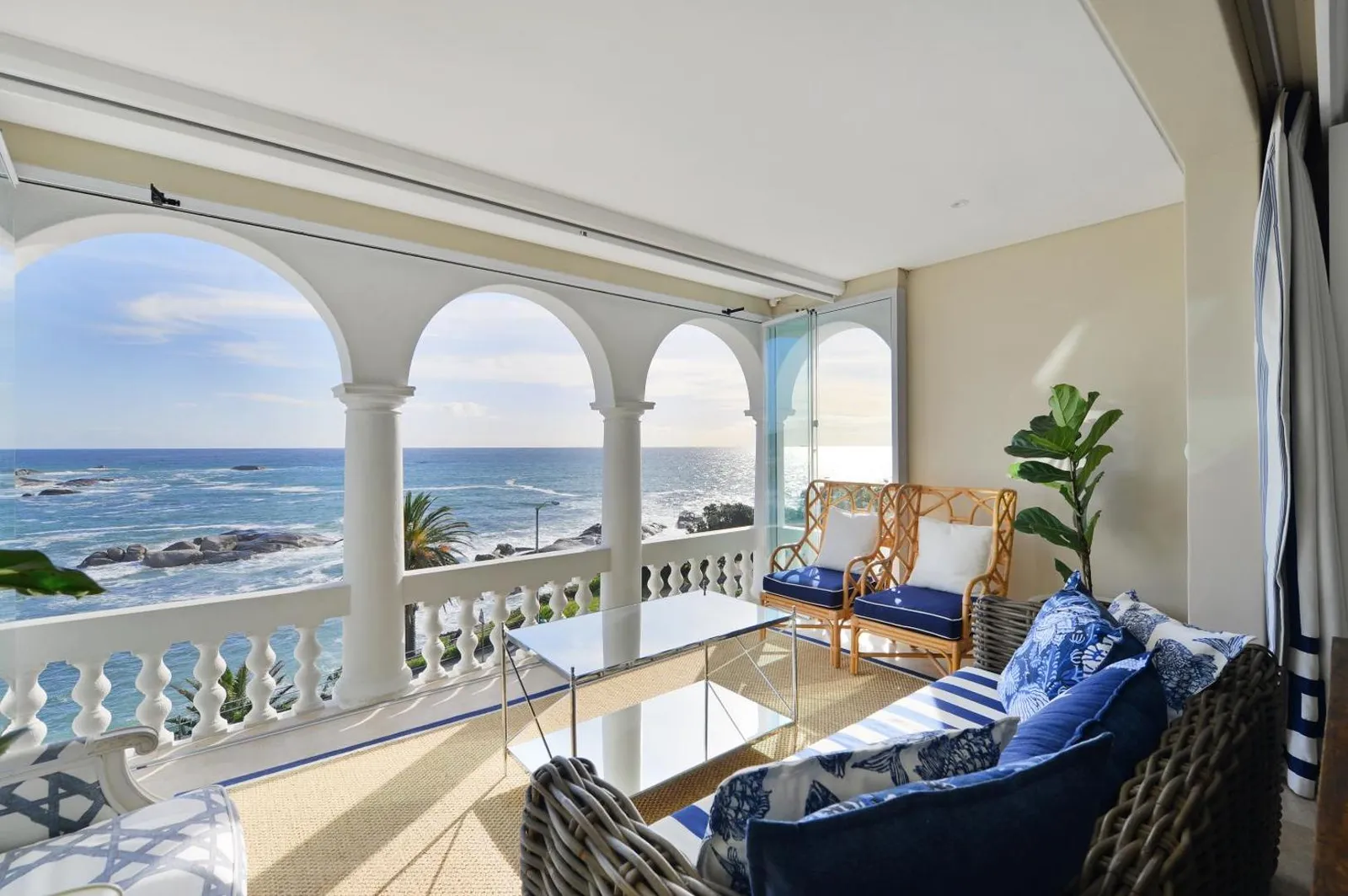 Veranda seating under the arches facing the ocean