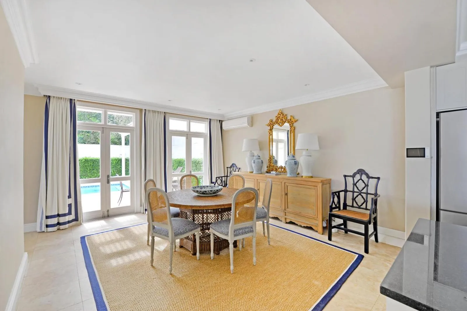 Dining room with a long table and garden outlook