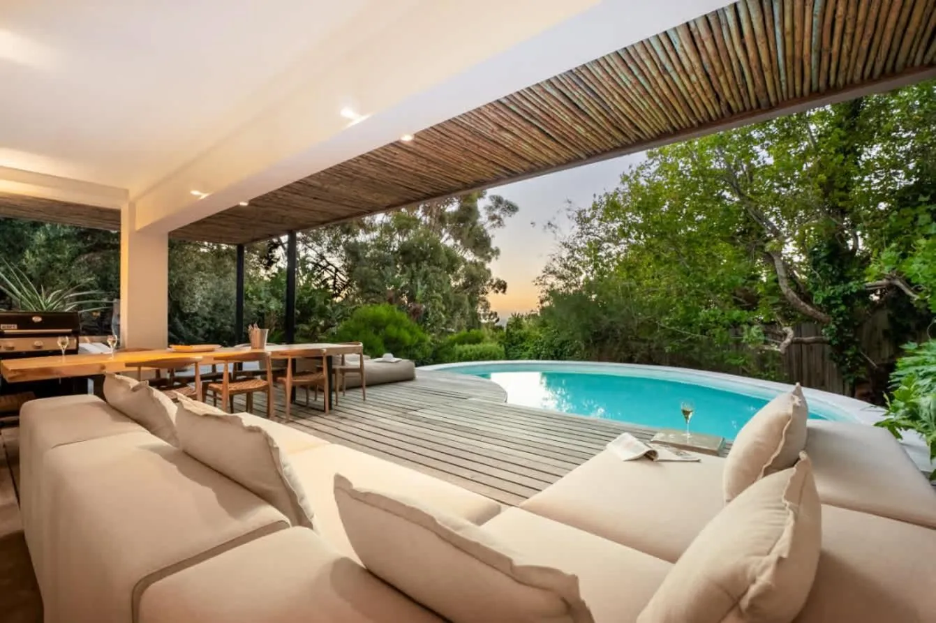 Covered terrace lounge overlooking the pool