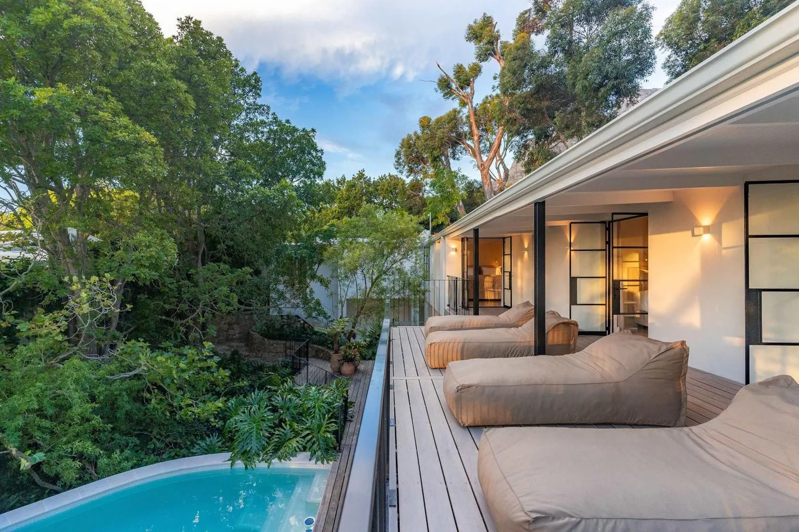Deck seating running the length of the pool