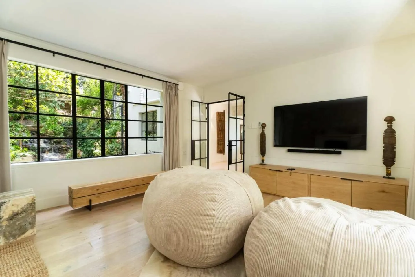 Second lounge with beanbags and a wall-mounted television