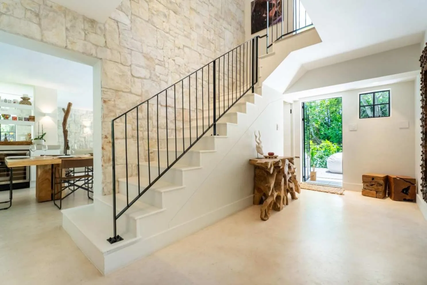 Staircase set against the stone-clad wall