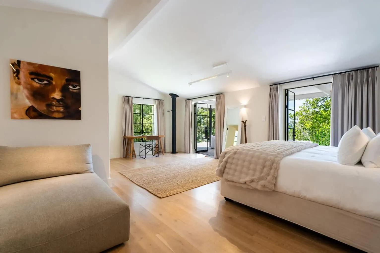 Main bedroom with doors opening onto the garden