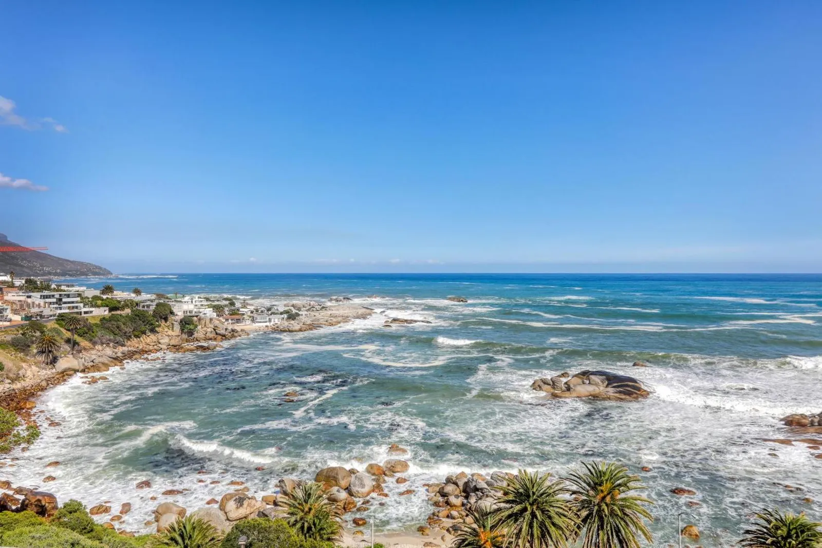 Rocky coastline and open ocean below the villa