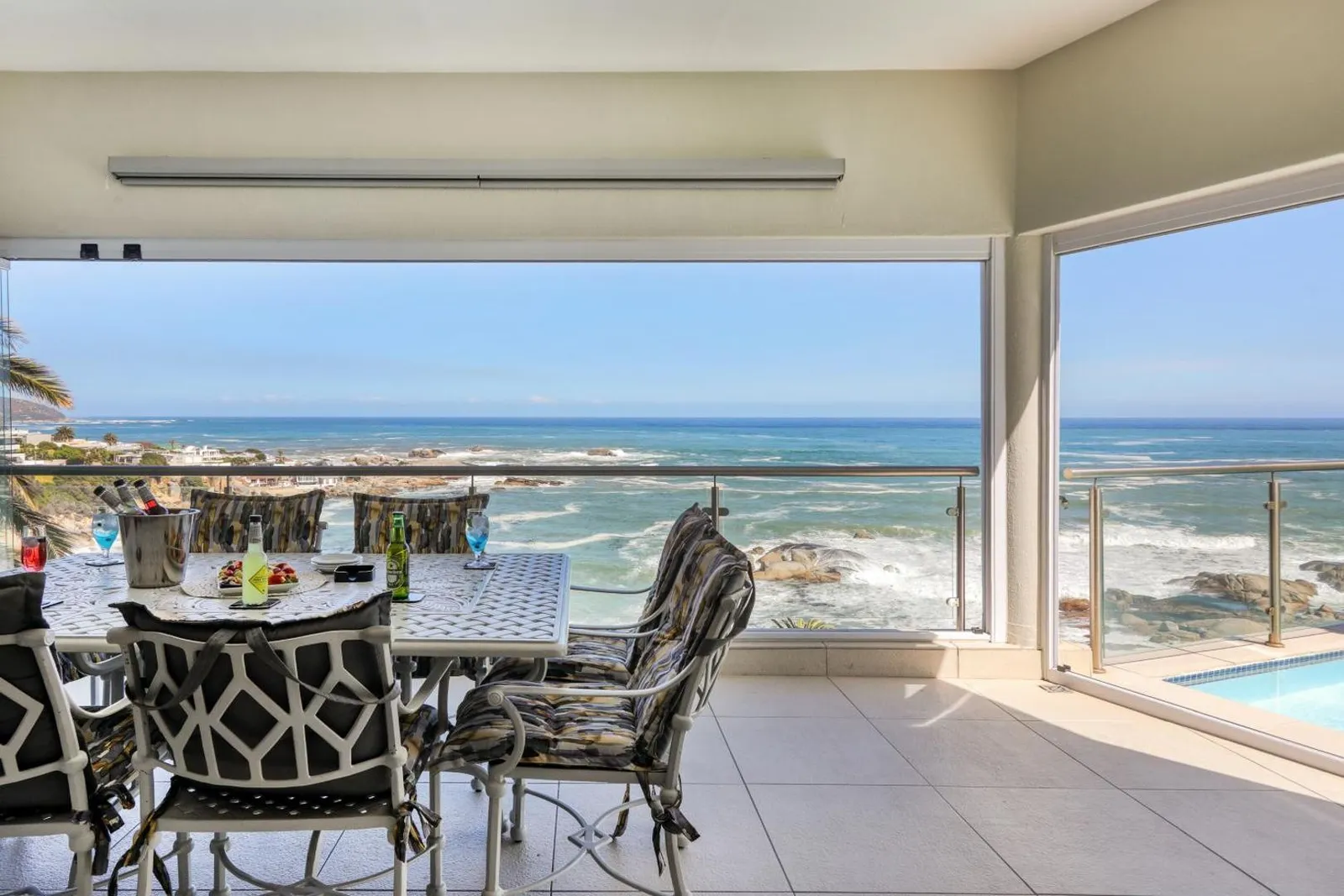 Outdoor dining table with the bay stretching out behind
