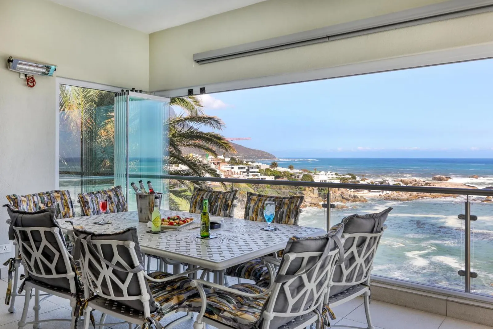 Terrace dining under a canopy with sea views