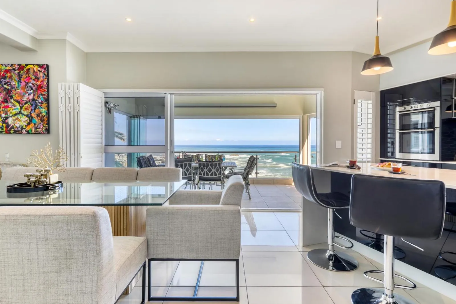 Open-plan living opening onto the sea-facing terrace