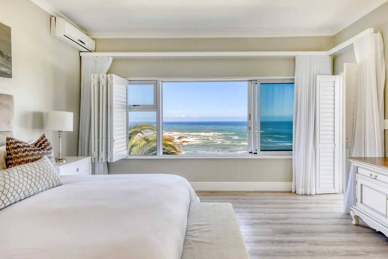 Bedroom with sea-facing sliding windows