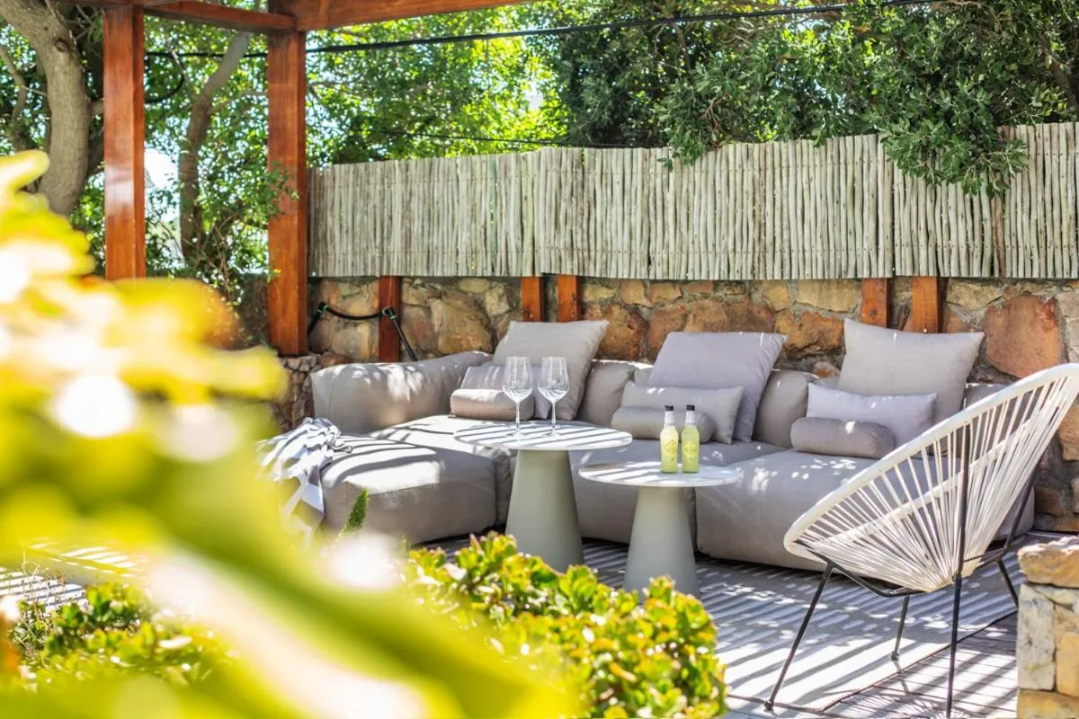 Sheltered garden lounge against the stone wall