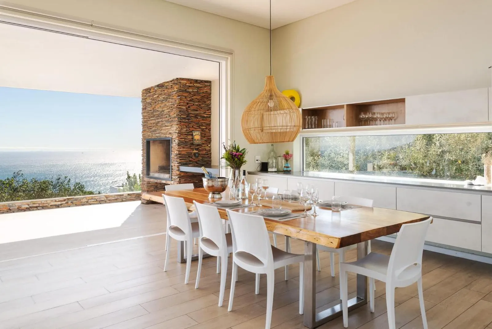 Dining table opening onto the sea-facing terrace