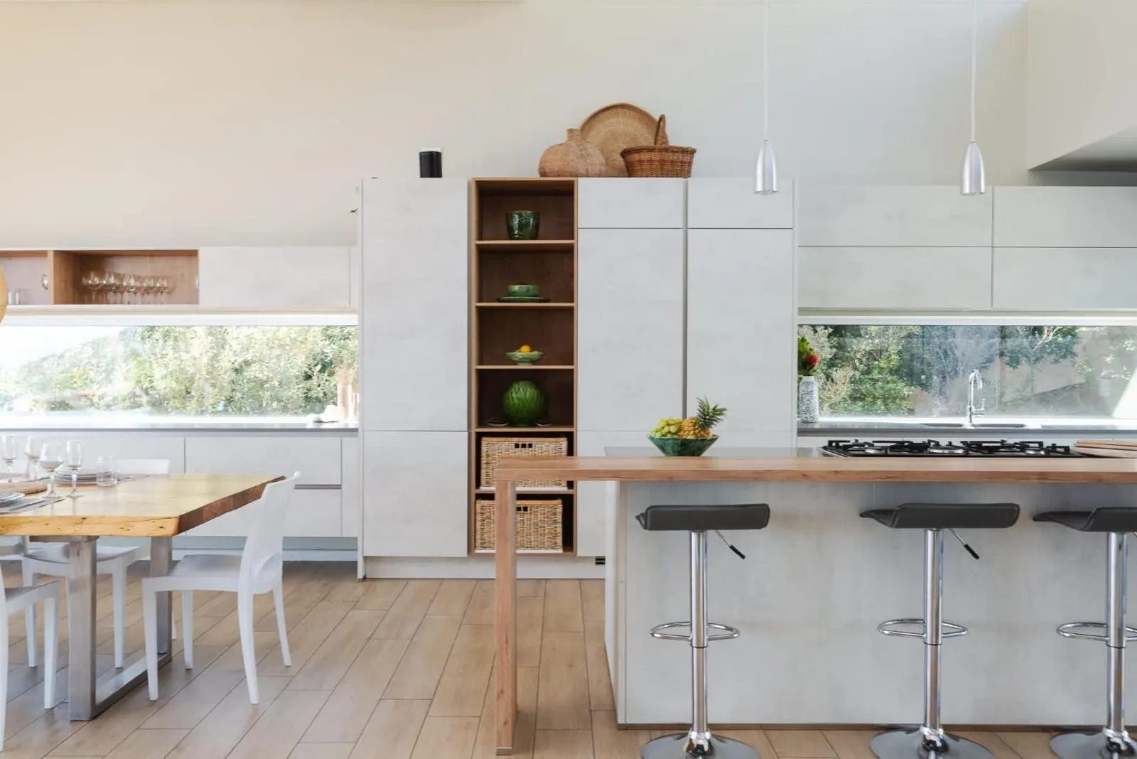 Kitchen island with a breakfast bar and bar stools