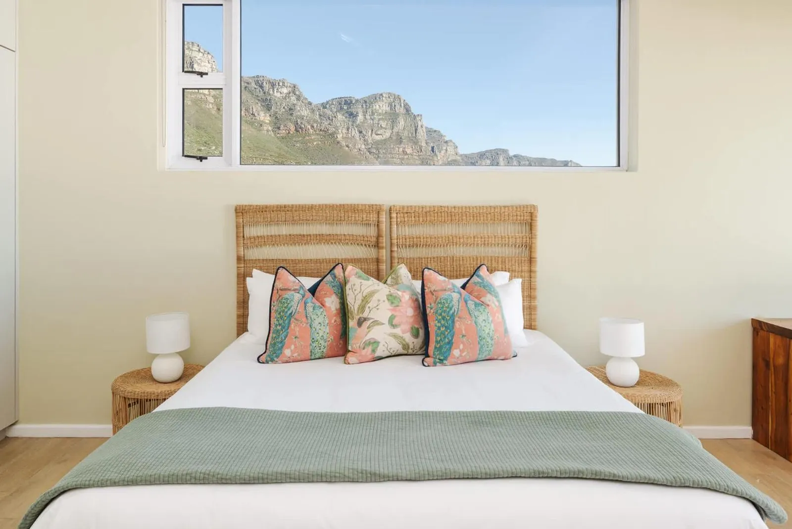 Bedroom with a mountain outlook through the window
