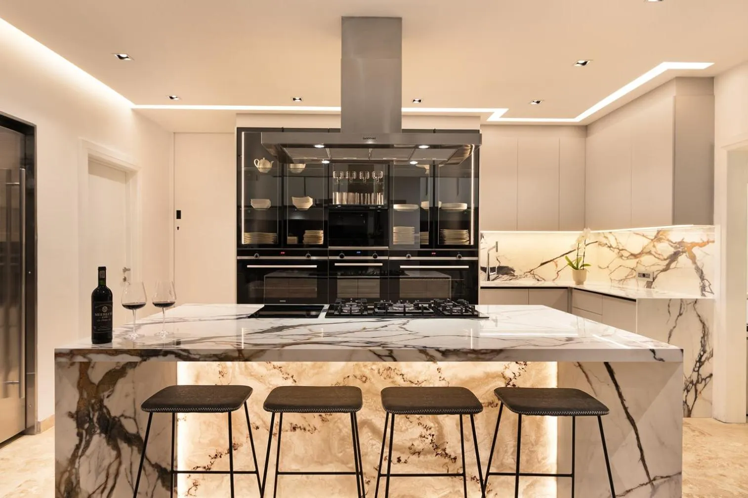 Kitchen with a professional range and fitted cabinetry