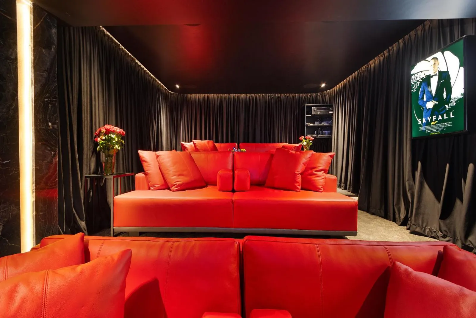 Cinema room with tiered red seating