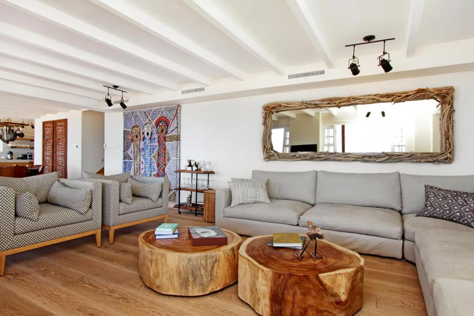 Lounge with reclaimed wood tables and linen seating