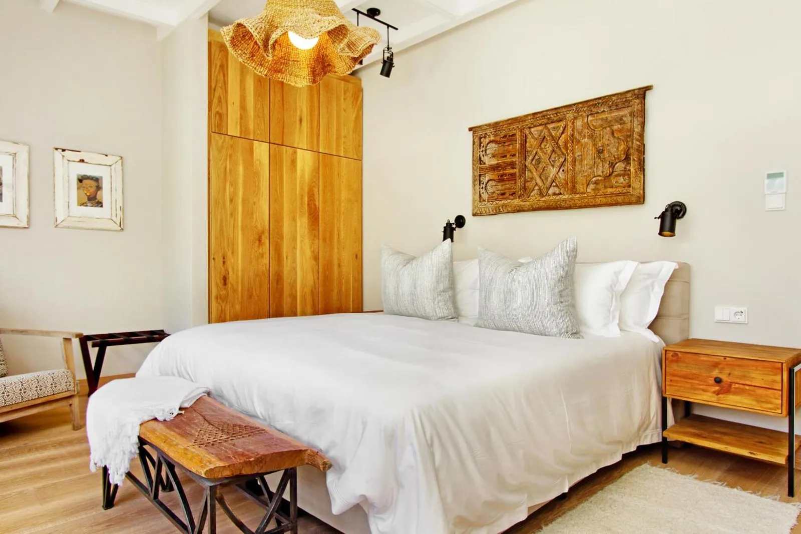 Bedroom with a carved timber headboard