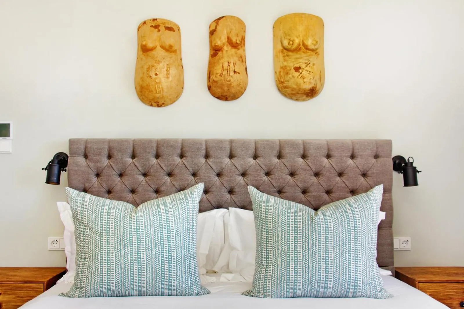 Bedroom with a buttoned linen headboard