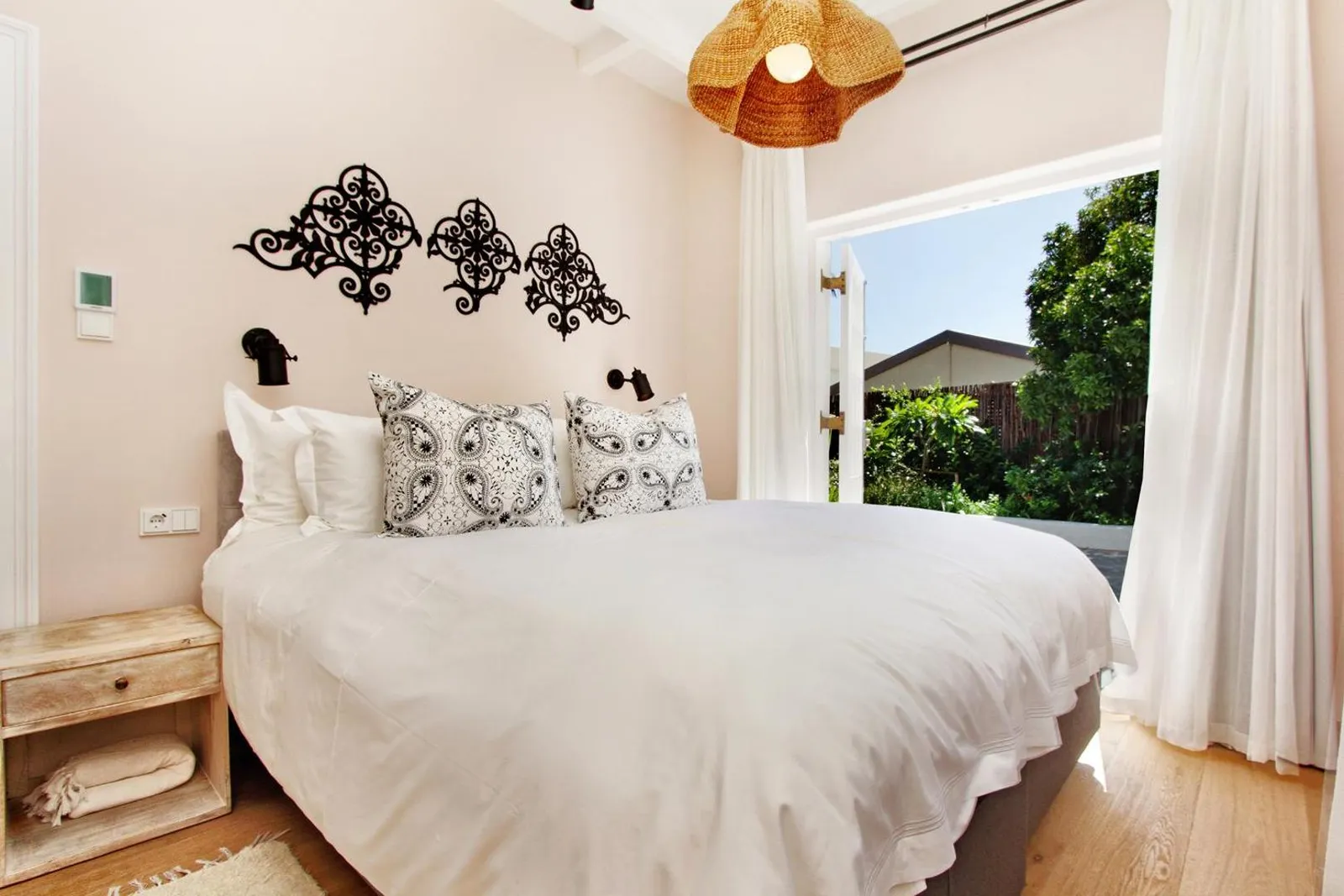 Bedroom with doors opening onto the garden