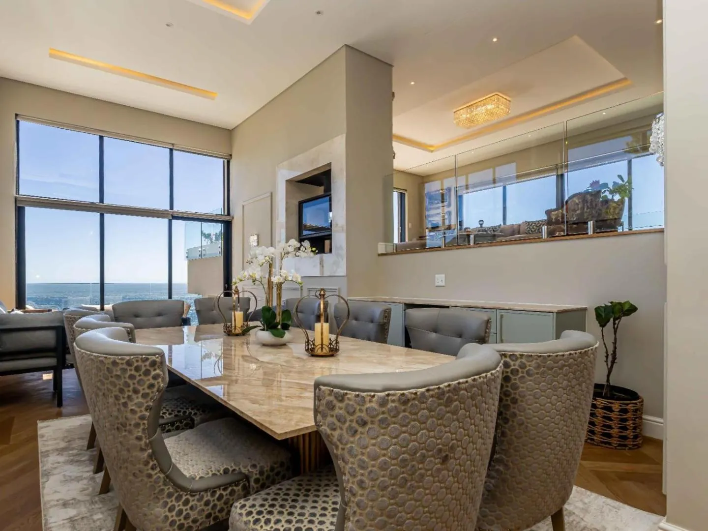 Open-plan dining and living with the ocean beyond