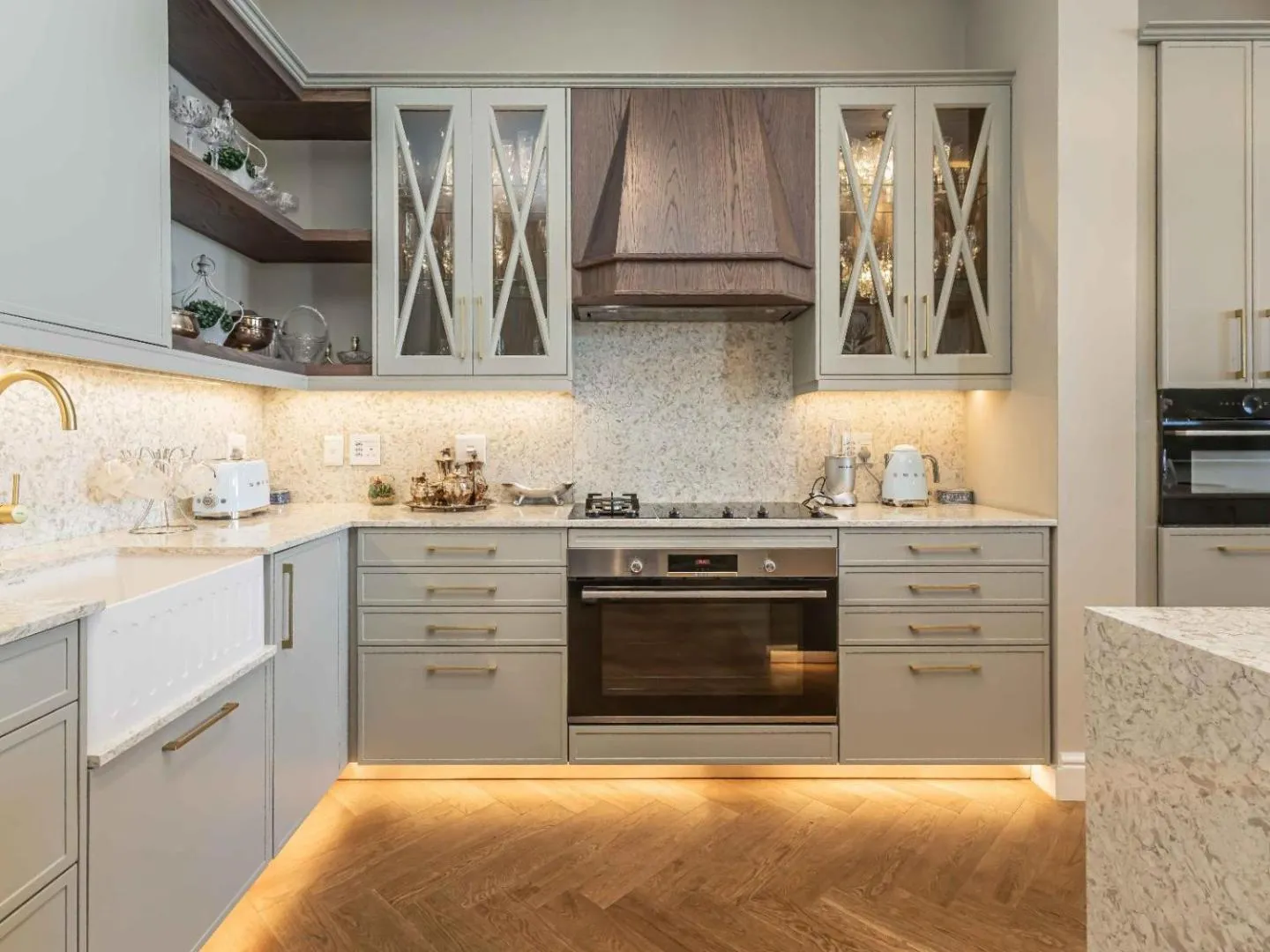 Second kitchen with fitted cabinetry and stone counters