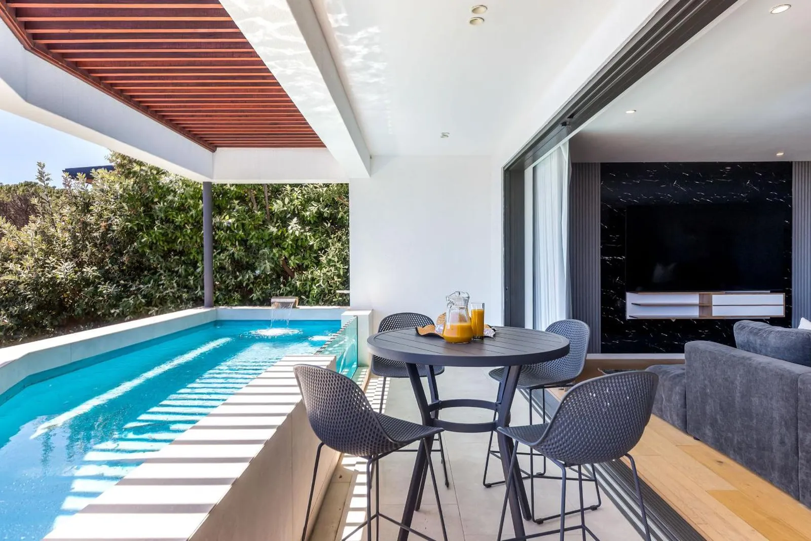 Heated pool seen from the shaded terrace table