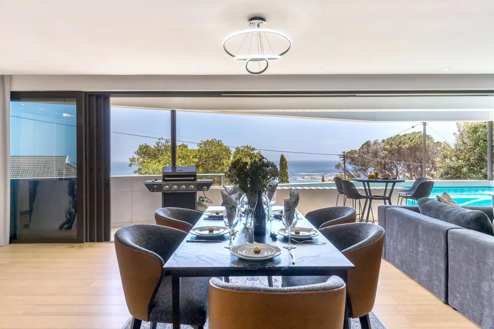 Dining room opening onto the pool terrace and the gas braai