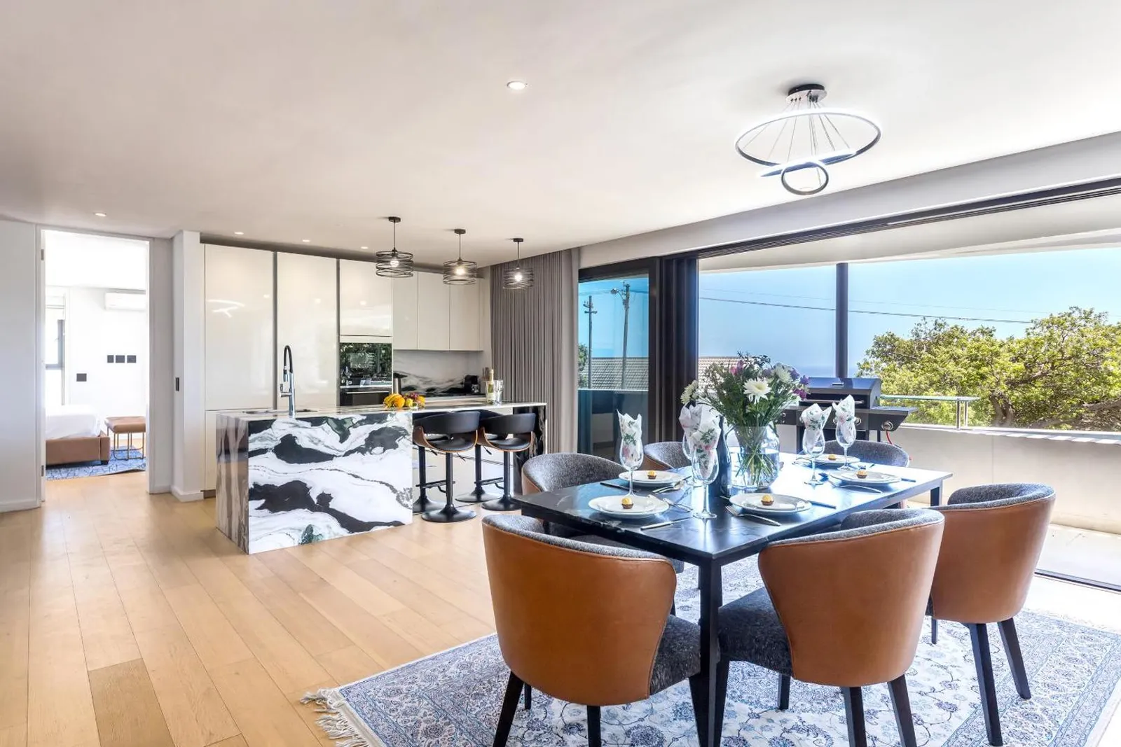 Dining and kitchen with the terrace doors folded back