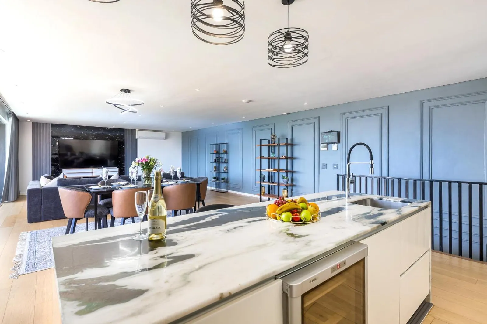 Marble kitchen island with dining beyond