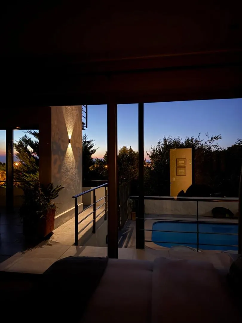 Terrace and pool lit at dusk