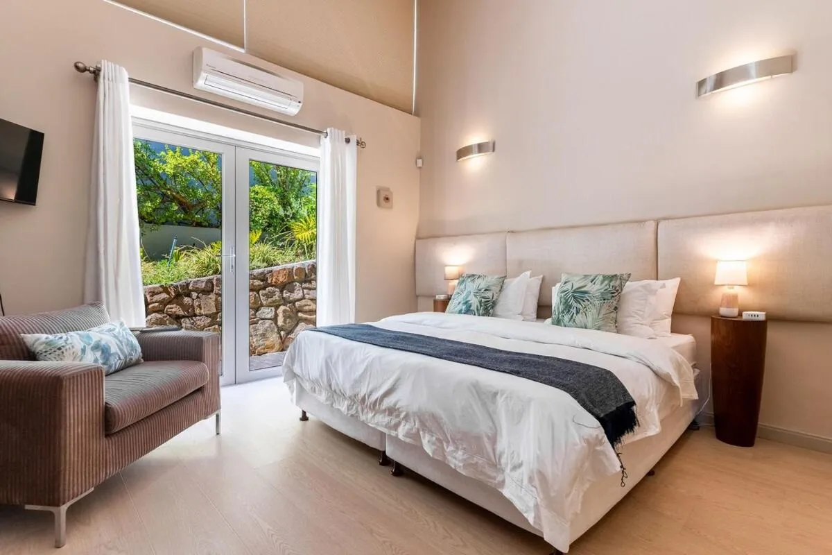 Bedroom with doors opening onto the garden