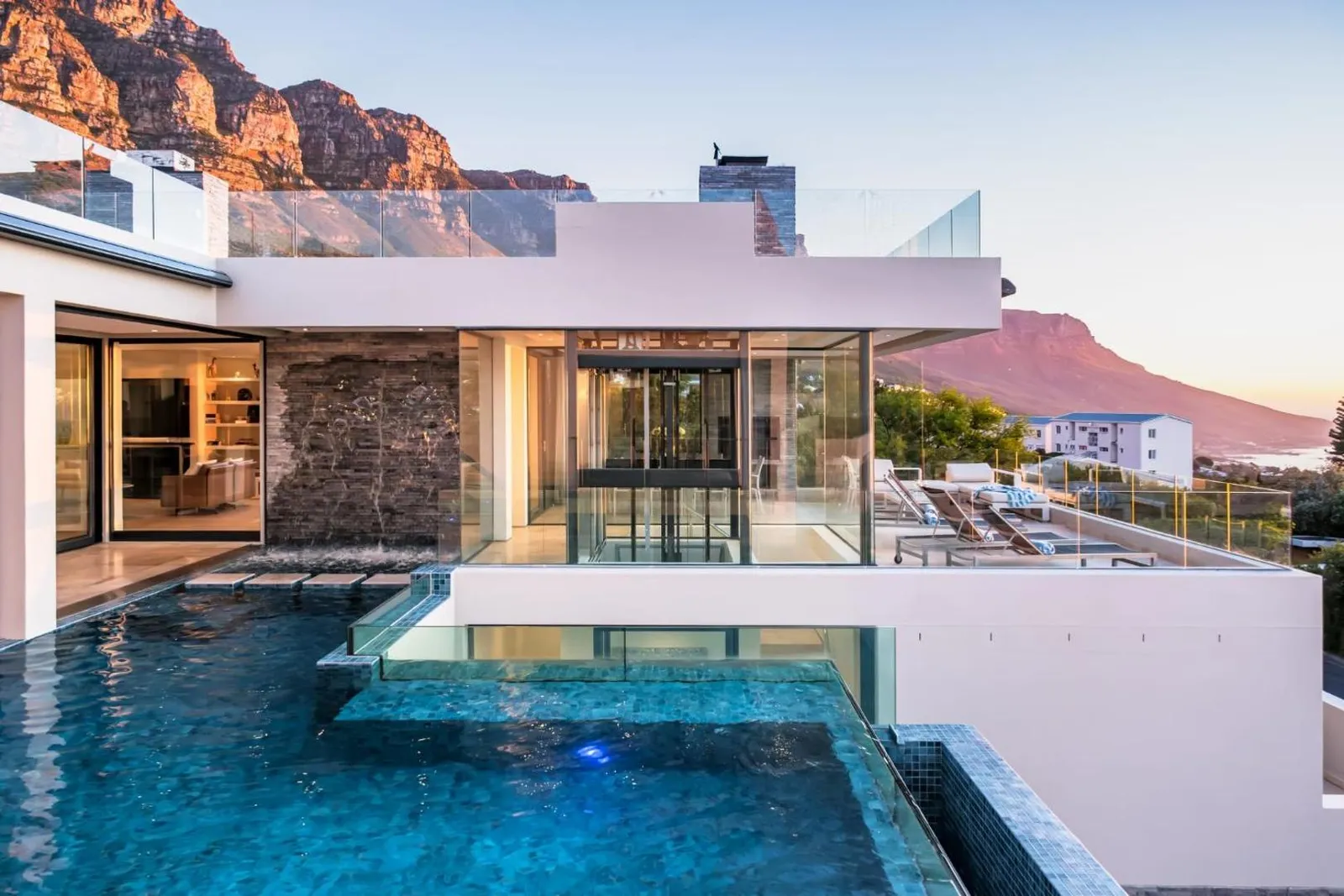 Villa at dusk with the infinity pool and Lion's Head behind