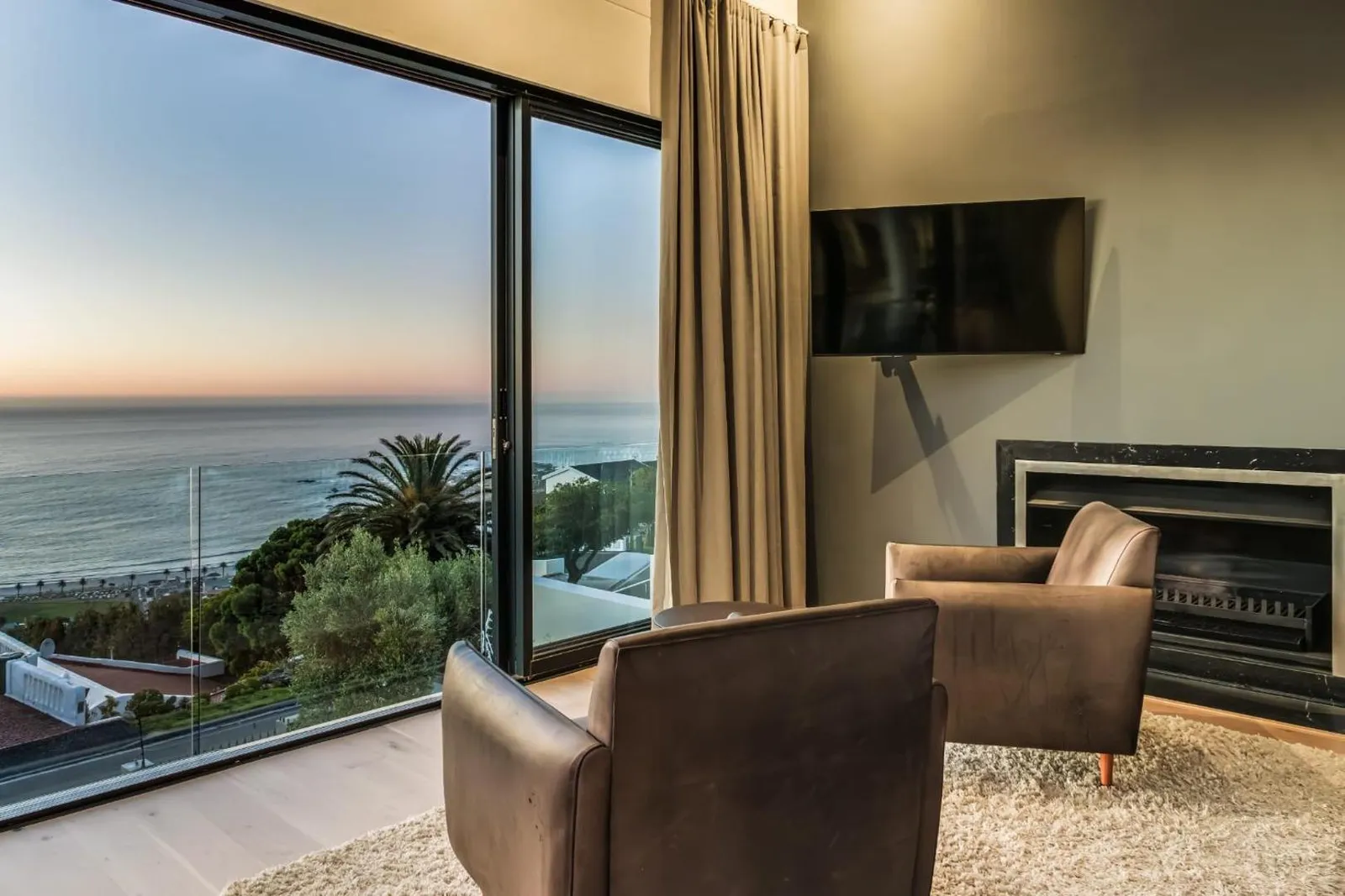 Lounge with a fireplace and sunset outlook