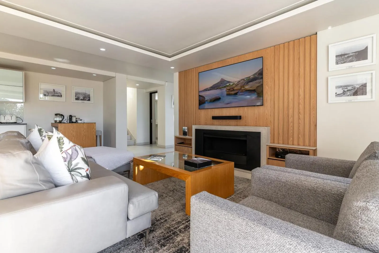Living room with a fireplace and deep sofas