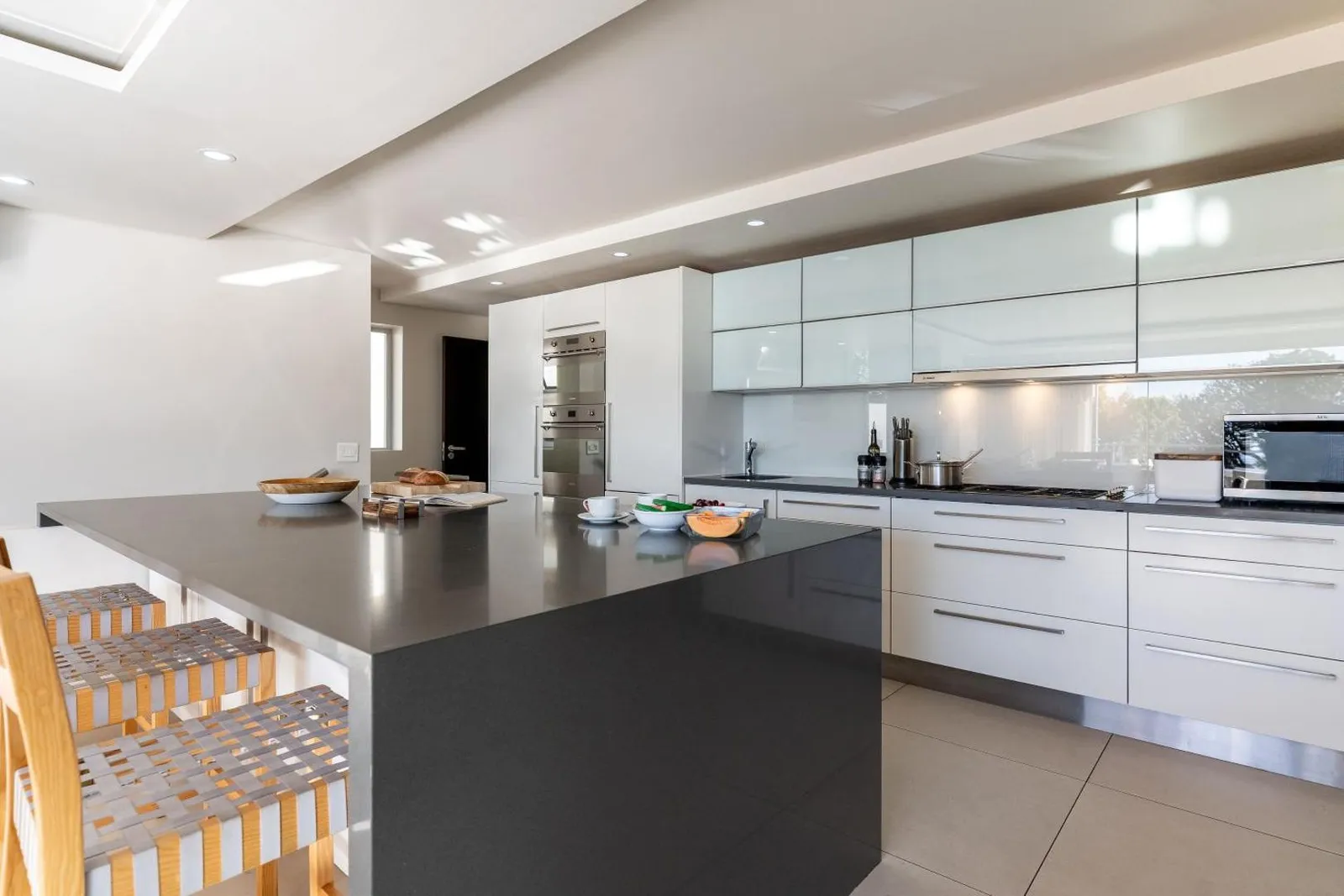 Kitchen island with bar stools and stone counters