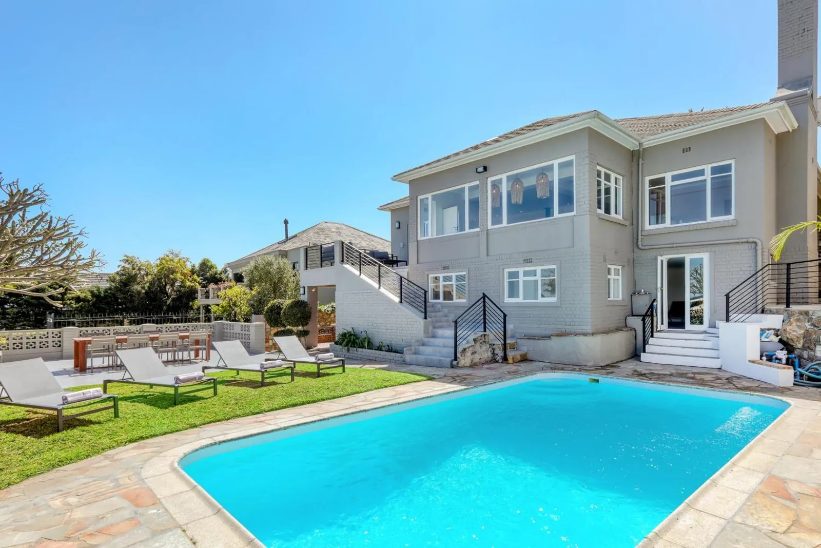 Villa exterior above the pool and lawn