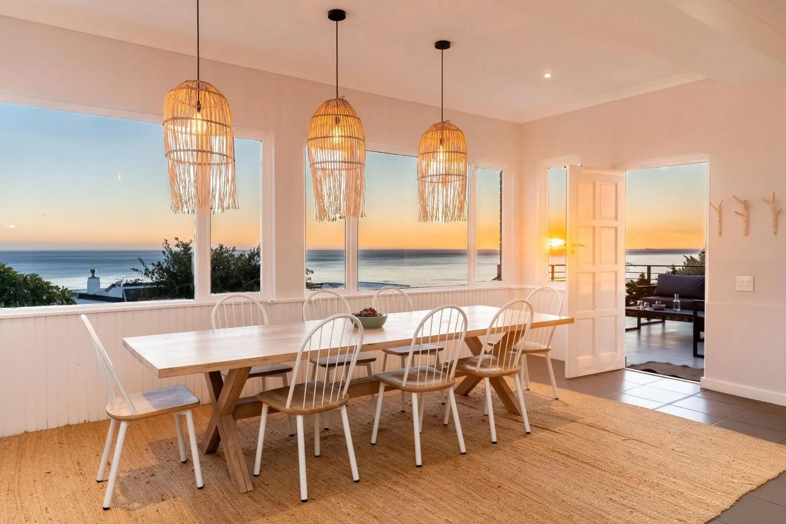 Dining room with sunset sea views through the windows