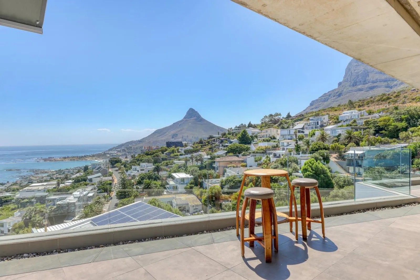 Terrace bar stools with Lion's Head above Camps Bay