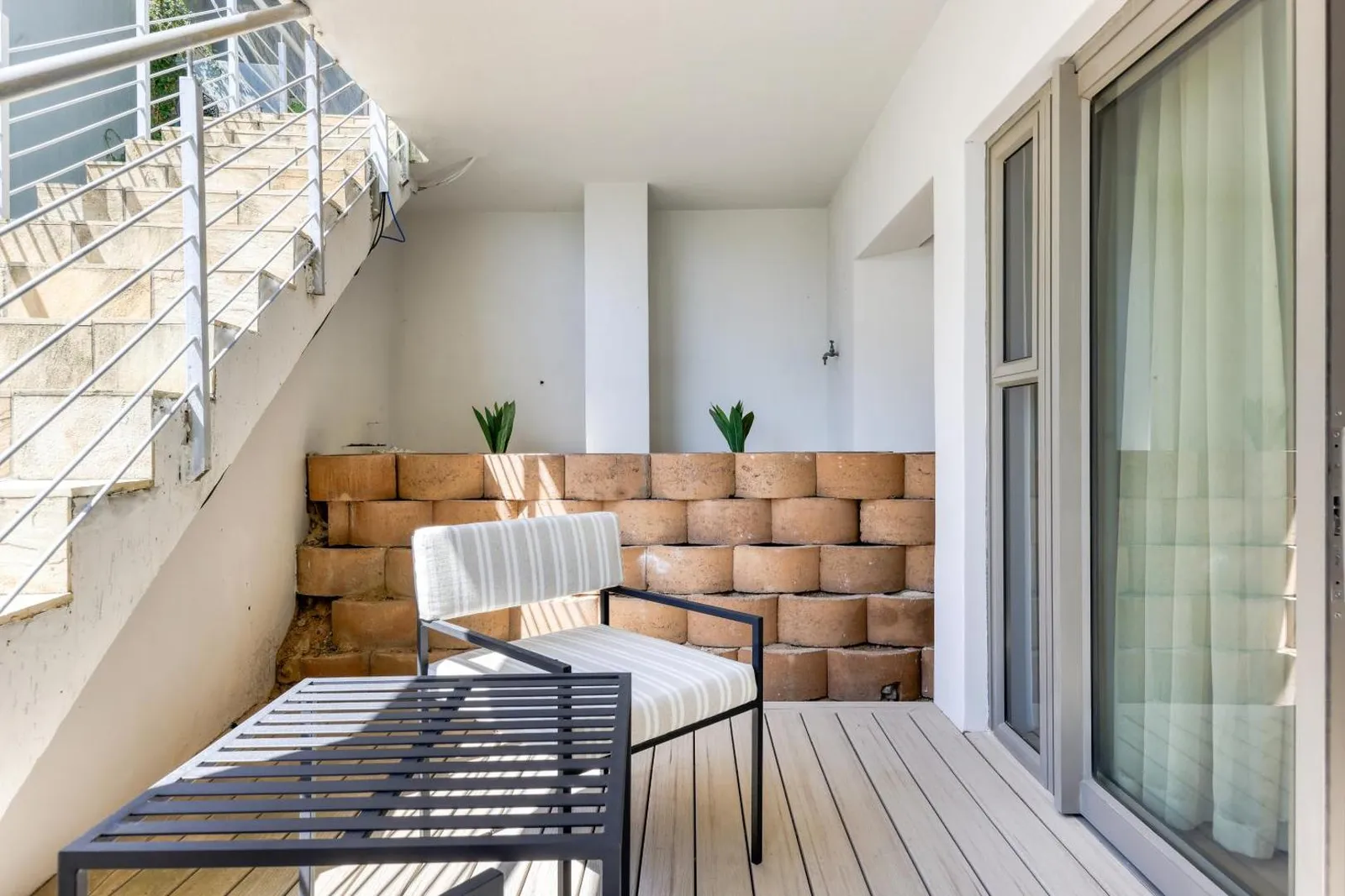 Sheltered courtyard with stone-clad seating