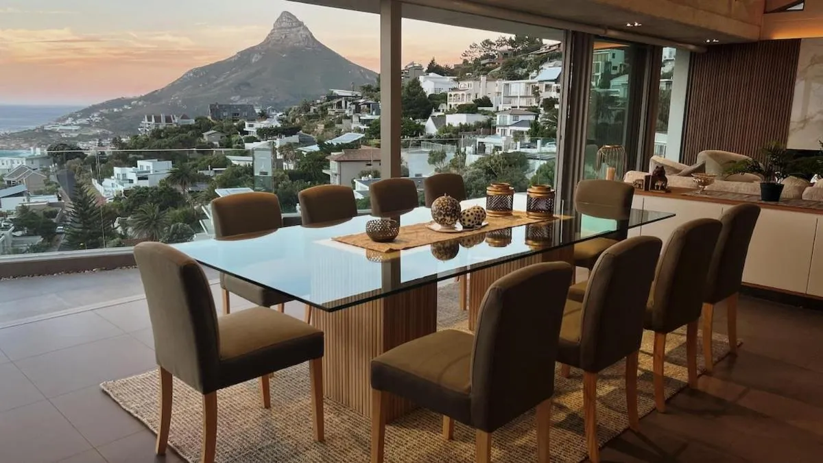 Glass dining table with the mountains beyond