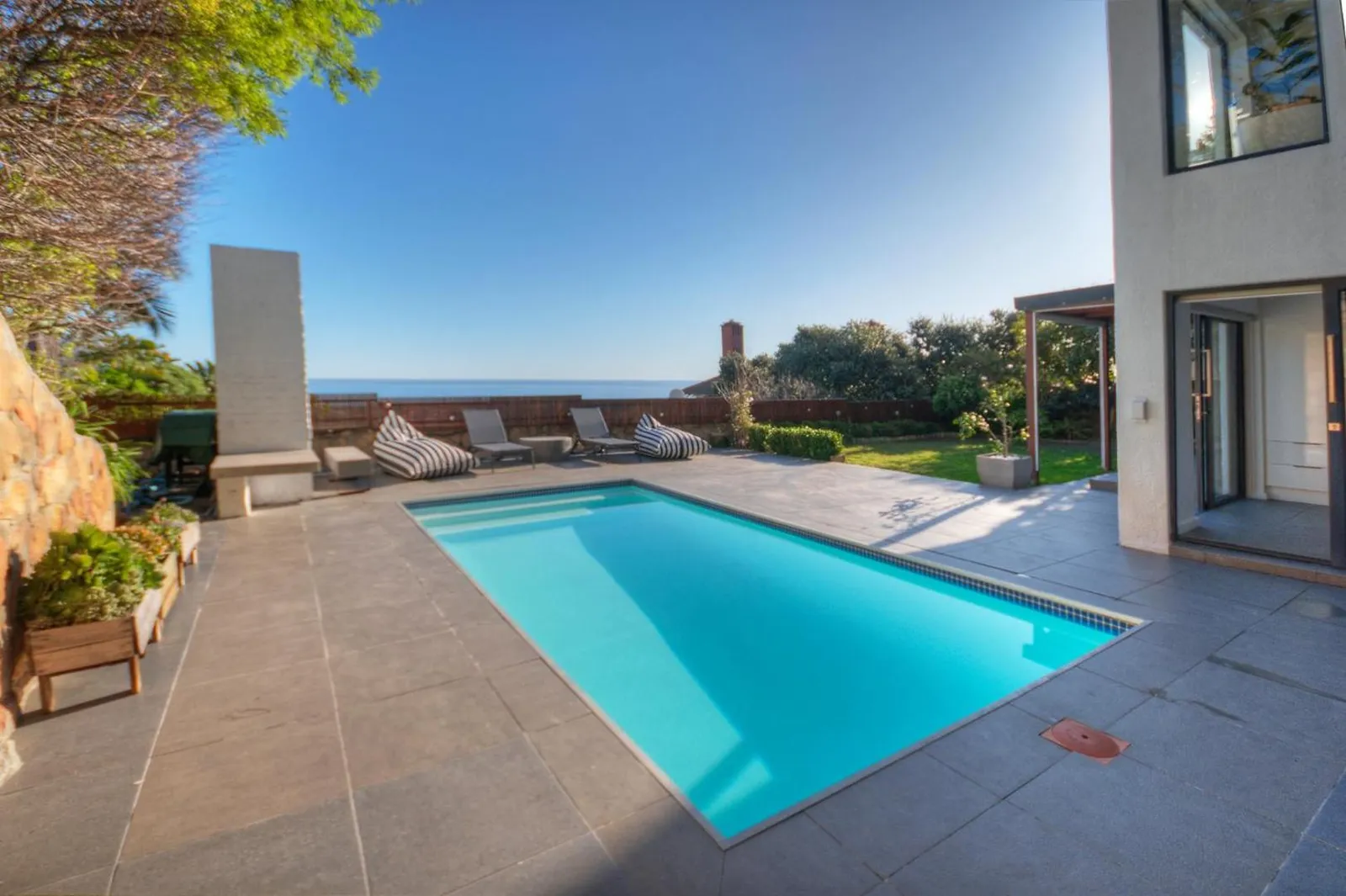 Pool terrace looking out over Camps Bay to the sea