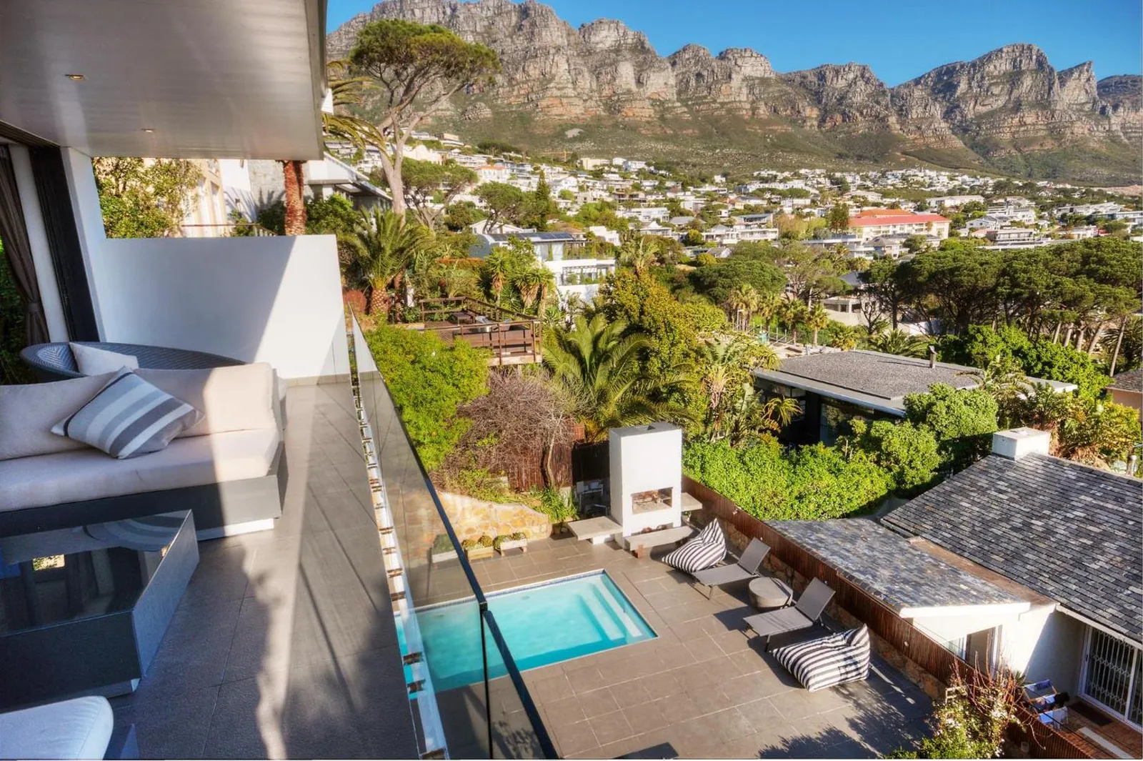 Balcony seating above the pool with Camps Bay beyond