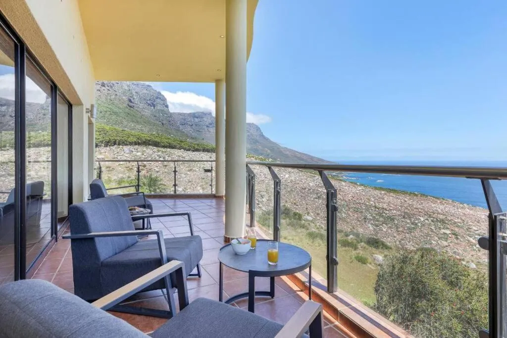 Balcony with mountain and sea on either side