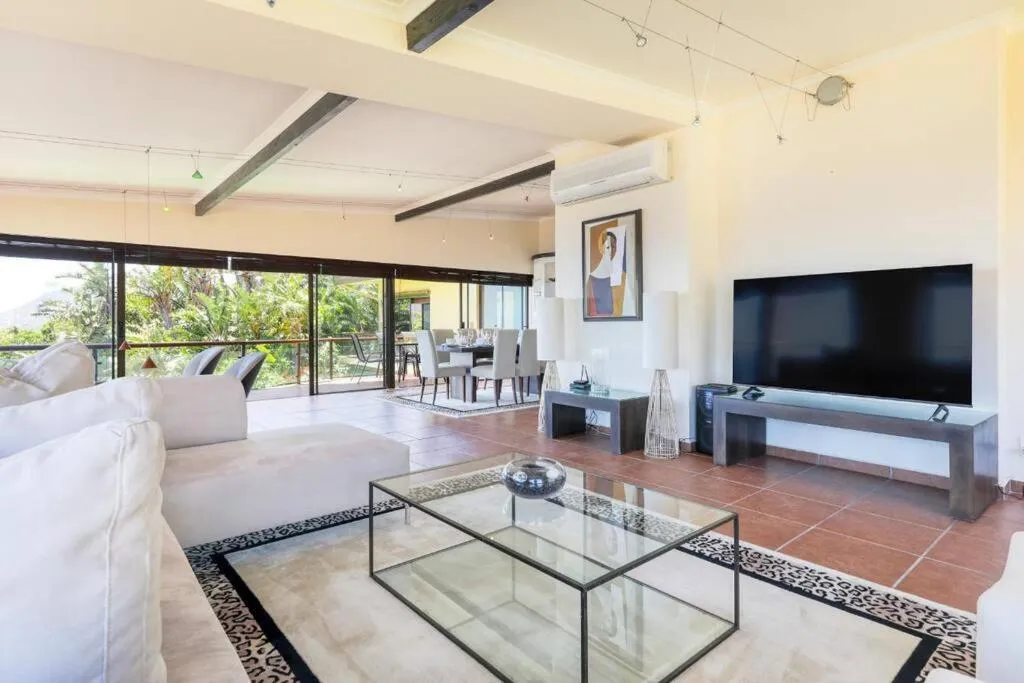 Living room opening onto the sea-facing terrace
