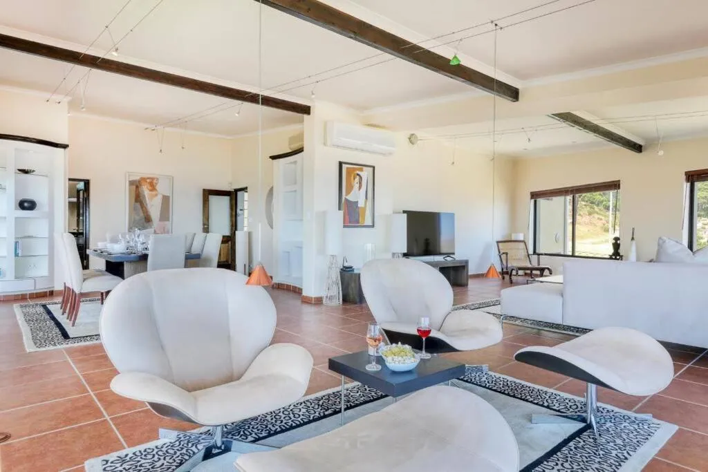 Lounge with sculptural white armchairs